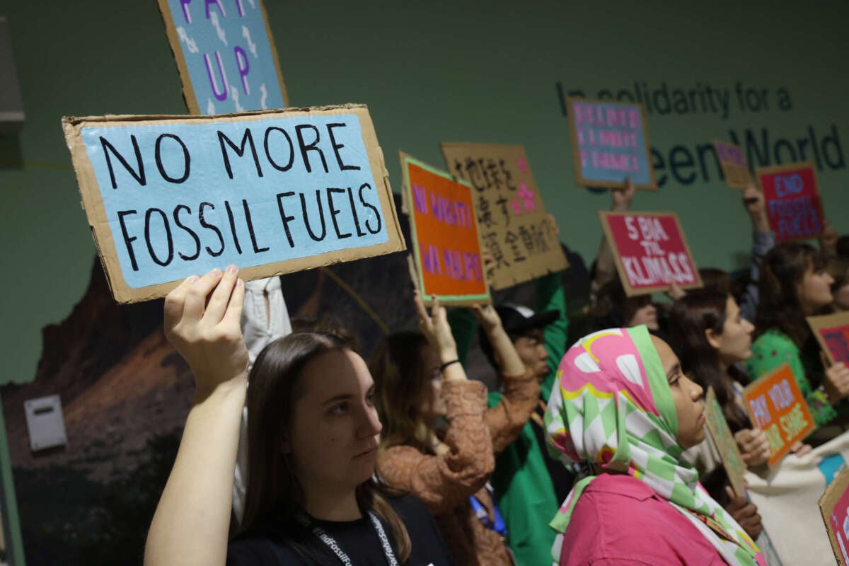 Activists protest against fossil fuels and for climate finance at the COP29 climate summit in Baku, Azerbaijan, on November 22, 2024.